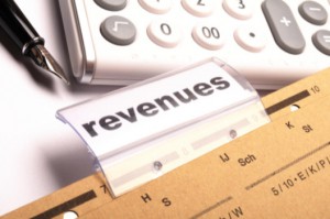 Close-up of revenue file folder and calculator: WeedWired Industry News Blog